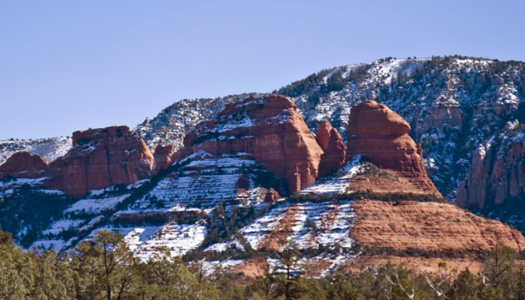 snow on the red rock buttes of sedona