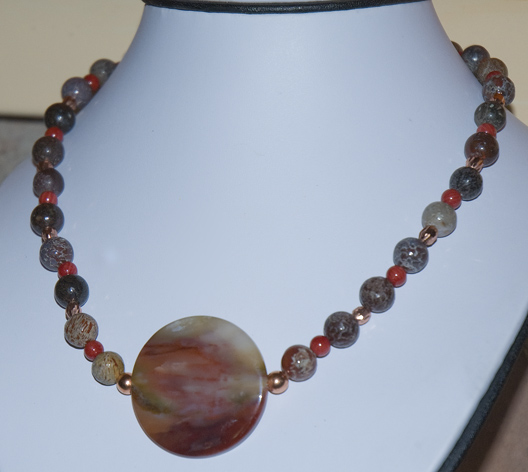 dinosaur bone beads with red coral beads