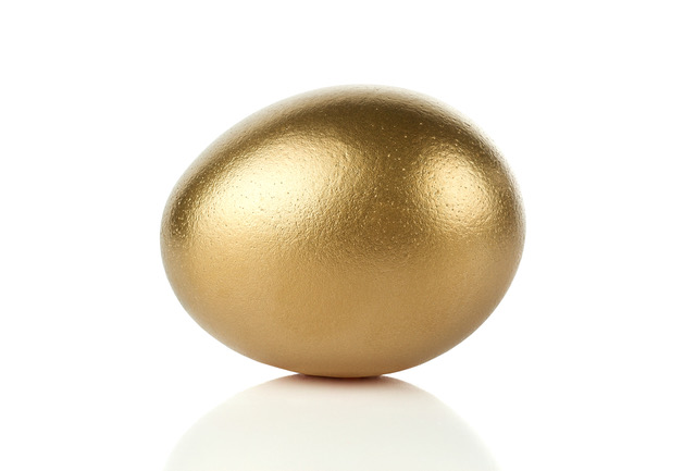Gold egg isolated on white background